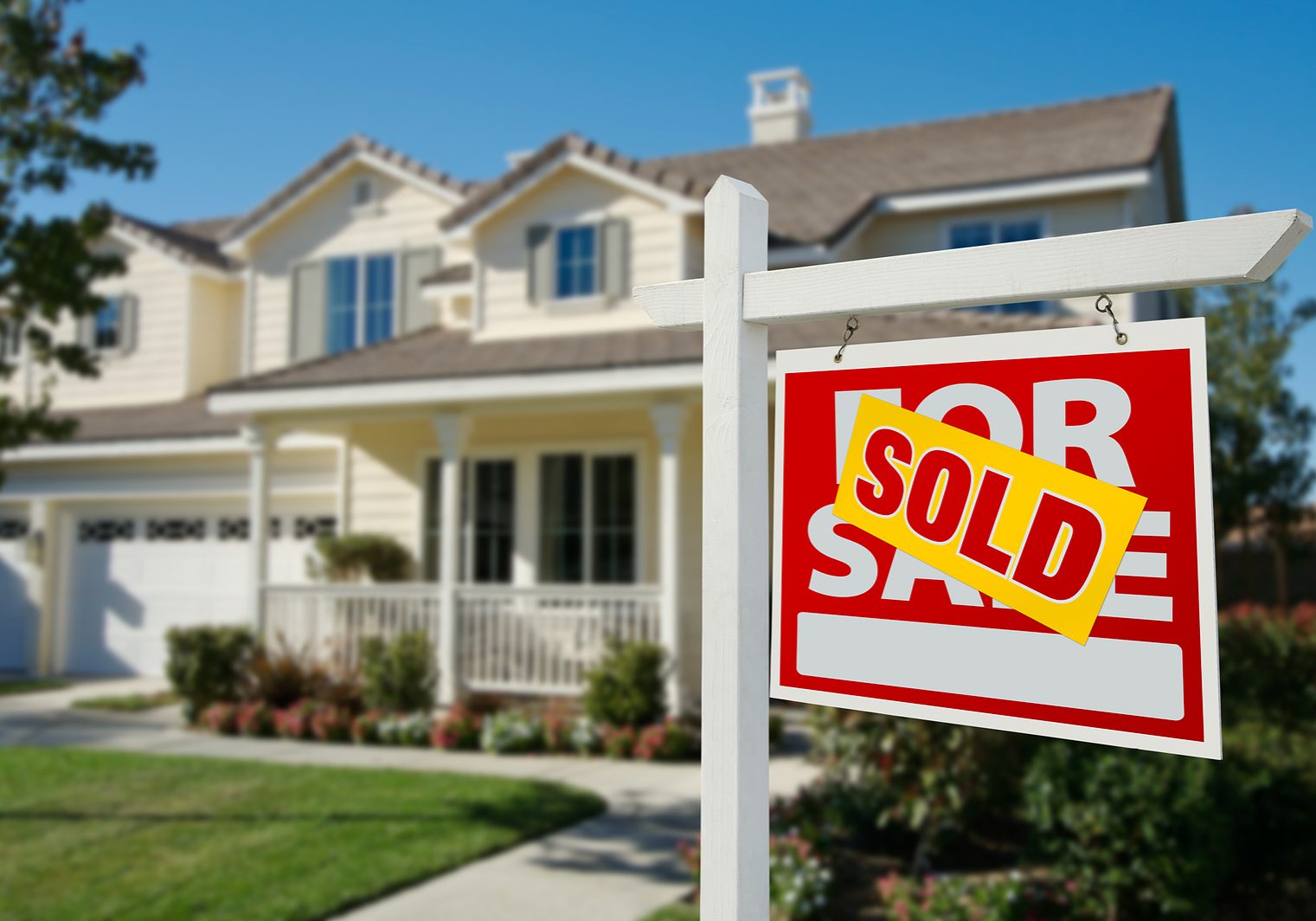 Sold Home For Sale Real Estate Sign in Front of New House.